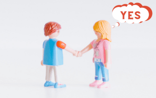 Image showing two toys shaking hands with a though bubble on one of the toys thinking yes
